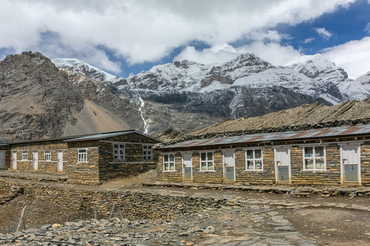 Tourists lodge on the Annapurna circuit trek with snowy mountain