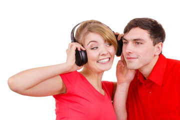Couple two friends with headphones listening to music