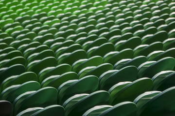 Fototapeta premium Seating rows in a stadium with weathered chairs