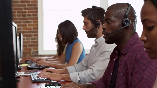Staff At Desks In Customer Service Department Shot On R3D