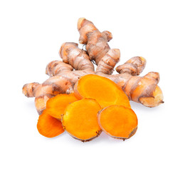 Turmeric roots, slices of fresh turmeric root isolated on white