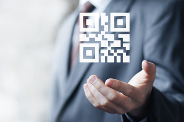 Businessman pressing button qr code network
