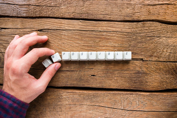 man changes the word impossible to possible