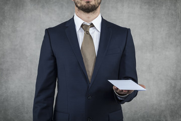 businessman holding a bribe on hand