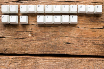 the words impossible and i can't of keyboards keys and space for text