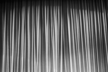 Obraz premium Black and white curtains and light.