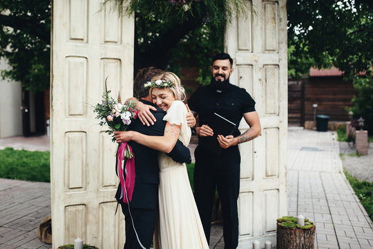 Pretty bride holding her groom