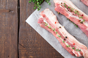 Raw meat. Pork ribs with herbs and spices