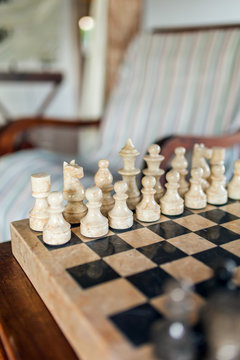 Beautiful stone chess board close-up in cozy living room