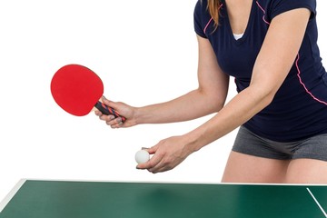Female athlete playing table tennis