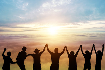 silhouette of Group Hipster Teenagers Jumping at the sunset