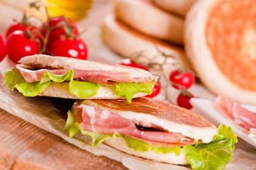 Tigella bread stuffed with ham and lettuce.