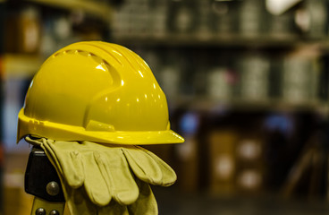Yellow Hardhat and gloves on a ladder