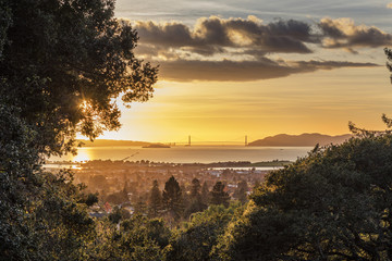 Panorama Golden Glow Sunset of San Francisco Bay looking over East Bay Berkeley - obrazy, fototapety, plakaty