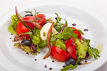 Italian salad with vegetables, herbs, smoked meat, ricotta and p