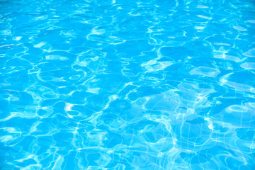 Fototapeta premium Ripple water suface in swimming pool with sun reflection