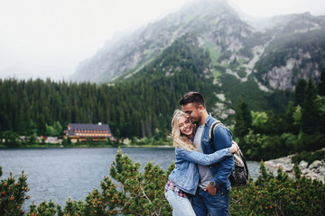 Naklejka premium incredibly beautiful couple in love on the background of the mou