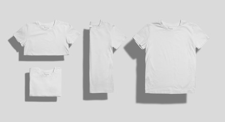 Unlabeled white shortsleeve cotton t-shirt folded in three different ways and lying flat on white background