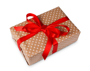 Christmas holiday gift box in spotted paper isolated on white