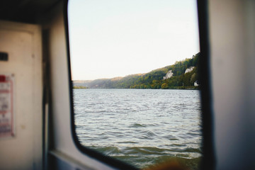 view of the blue sea from boat window