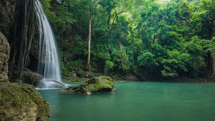 Fototapeta na wymiar Green and clean waterfall for relaxation, Erawan's waterfall , L