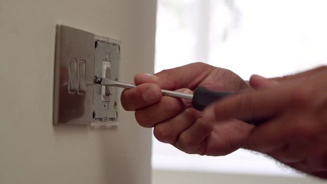 Electrician Repairing Domestic Light Switch Shot On R3D