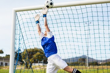 Female athlete running from starting blocks