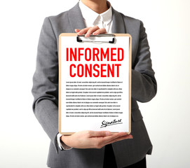 woman showing a written informed consent