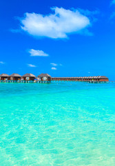 Plakat beach with water bungalows Maldives