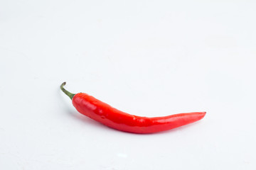 Red chili peppers on a white background closeup