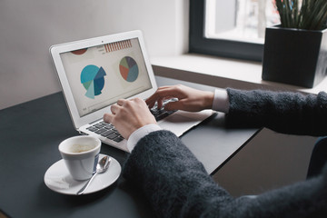 Woman's hands typing on notebook