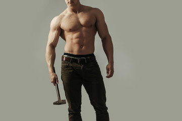 sexy muscular man with hammer
