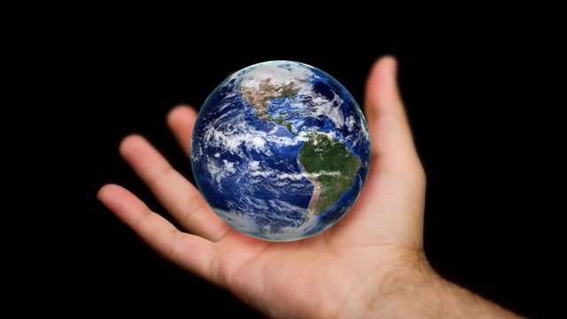 Orbiting globe in human hands