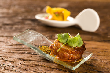Pork ballotine with pururuca, water flour, pumpkin puree and sprouts in a spoon. Taste gastronomy fingerfood