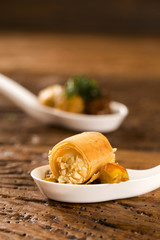 Crunchy with cheese mousse, accompanied with cashew and cashew cashew nuts in a spoon. Taste gastronomy fingerfood