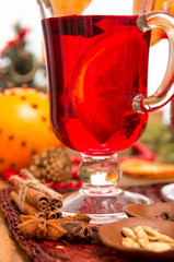 Glass of mulled wine over on wooden table.