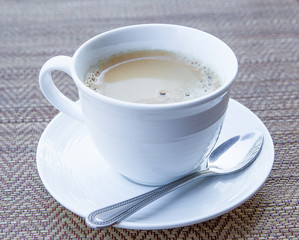 coffee in a white cup and saucer