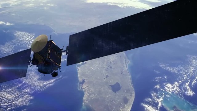 Communications satellite orbiting earth