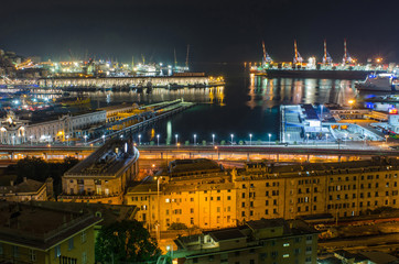 Vista of the beautifully lit Harbor of Genoa, seen from the rooftops of the San Teodoro neighborhood