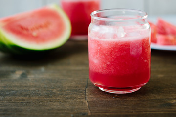 Delicious watermelon smoothie on the wooden board. Smoothie - vegetarian coctail from fresh fruit - watermelon