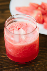 Delicious watermelon smoothie on the wooden board. Smoothie - vegetarian coctail from fresh fruit - watermelon