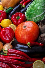 Vegetables and fruits on a wooden background.
