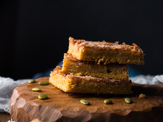 Winter pumpkin spiced blondies on dark background
