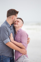 Close up image of a same sex or Gay male couple being loving and