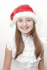little girl in red santa hat 