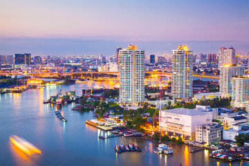 Fototapeta na wymiar The City of Chaopraya river with light and reflection in twilight. Bangkok, Thailand