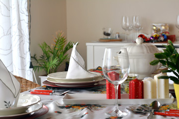 Christmas dinner table with candles with christmas atmosphere