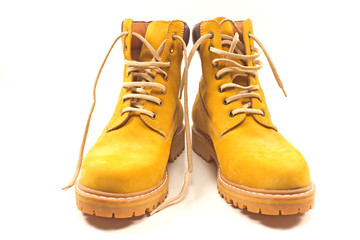 New yellow winter boots isolated on white
