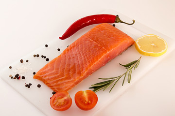 Salmon filletwith vegetable over on white background.