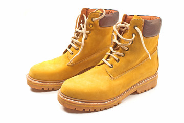 New yellow winter boots isolated on white